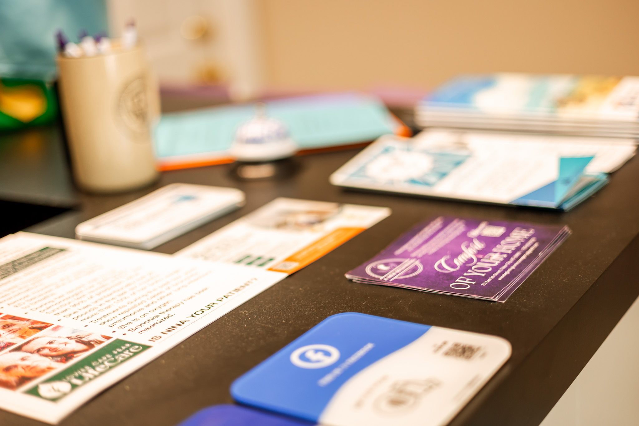 Business cards and brochures on a desk